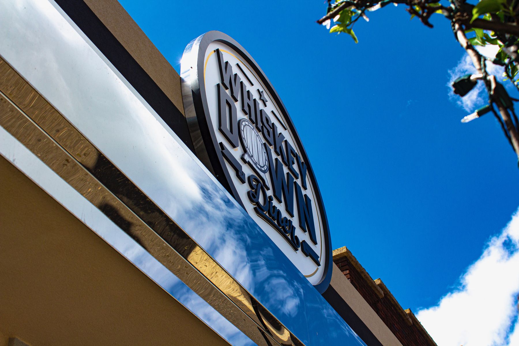 The Whiskey Down Diner sign above the Farmingdale storefront